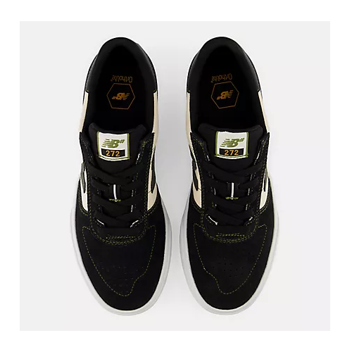 A top view of a pair of New Balance 272 sneakers in black suede and mesh with cream accents, shown from a top-down view on a light gray background.