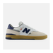Side view of a New Balance 306 cup sole shoe. White shoe with gum sole and navy accents. 