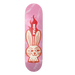 A pink skateboard deck with a stylized cartoon bunny face and red flames, featuring the brand name 'PYLON' printed vertically, set against a solid black background.