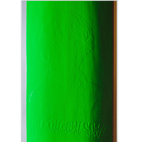 A neon green FA skateboard close up picture of the embossed graphic and logo on a white background. 