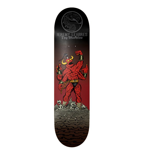 A skateboard deck featuring a graphic illustration of a red horned demon standing on a rocky surface, with a red-to-black gradient background and the text 'JEREMY LEABRES Toy Machine' near the top.