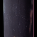 Close up picture of the embossed graphic on a black Hockey skateboard.