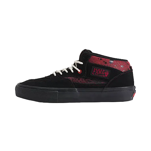 A black high-top skate shoe with red textured overlays, white laces, and a black sole, shown against a light beige background.