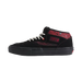 A black high-top skate shoe with red textured overlays, white laces, and a black sole, shown against a light beige background.