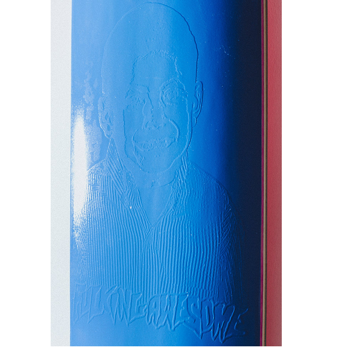 A close up picture of an FA skateboard with an embossed graphic and logo on a white background. 