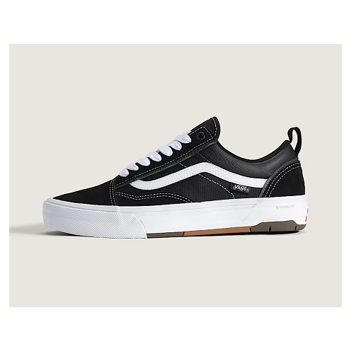 Side view of a Vans Old Skool Wafflecup black shoe with white Vans stripe and white sole. 