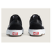 A pair of Vans Old Skool Wafflecup sneakers shown from the back, featuring a black upper, white soles, and red Vans logo patches on the heel.