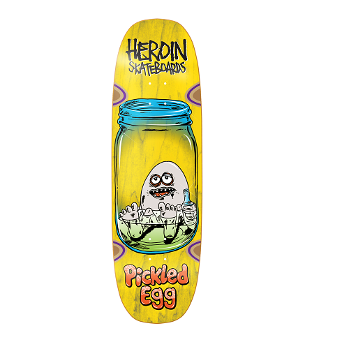 A yellow Heroin skateboard featuring an egg sitting in a mason jar holding a bottle with the text Heroin Skateboards Pickled Egg.