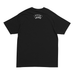 A black short-sleeve t-shirt shown from the back, featuring a white arched graphic on the upper back that reads 'BAKER SKATEBOARDS' on a white background..