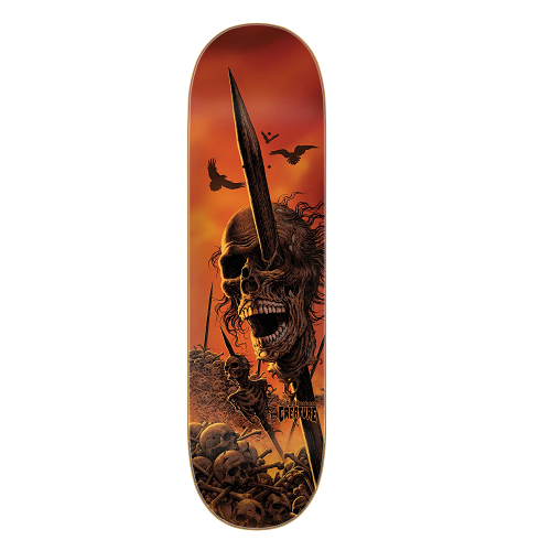 A orange and red creature skateboard featuring an after battle scene where several skulls are on pikes and the word Creature.