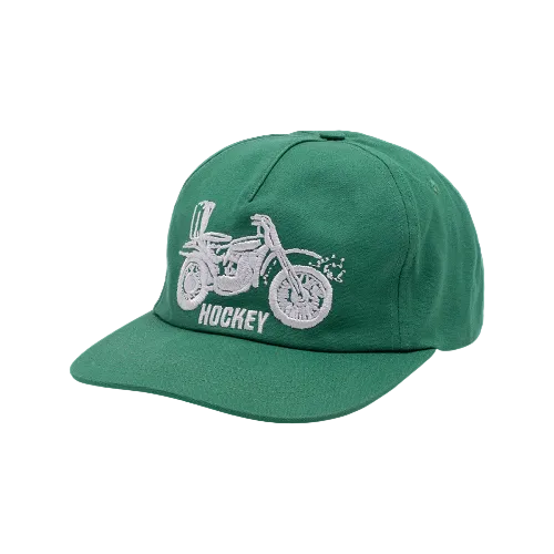 A green Hockey snapback hat featuring embroidered motorcycle and word Hockey on white background. 