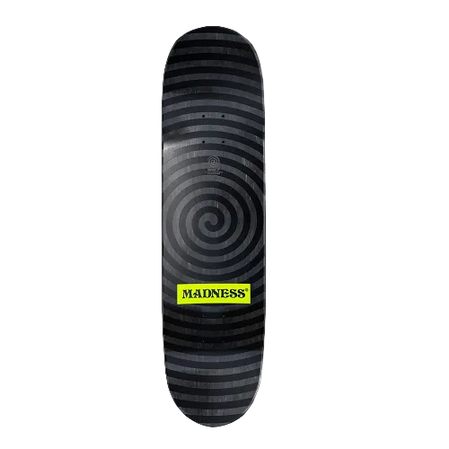 Top of a black stained Madness skateboard with a spiral design in black the neon yellow logo of Madness. 