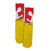 A pair of Toy Machine socks half orange and half yellow featuring a person holding a skateboard with the text Toy machine.
