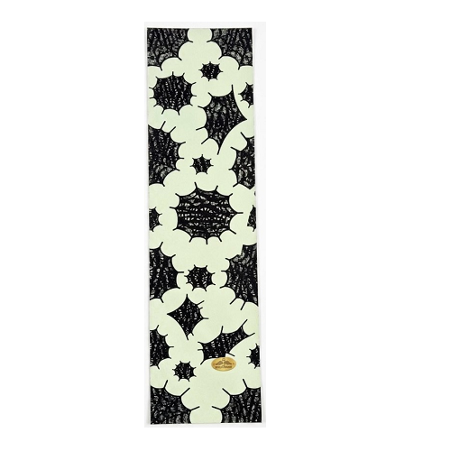 Skateboard grip tape spider webs on glow in the dark grip.