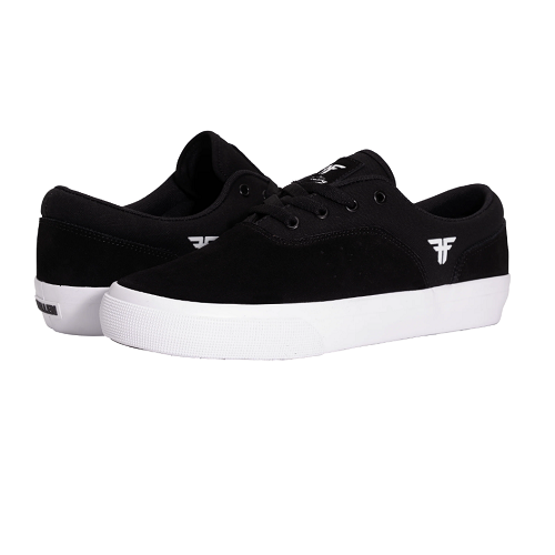 A pair of black low-top sneakers with white rubber soles, featuring a white stylized logo on the side and tongue, set against a plain white background.